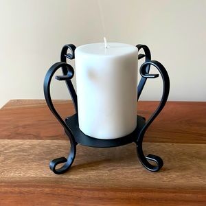Black iron candle holder with candle